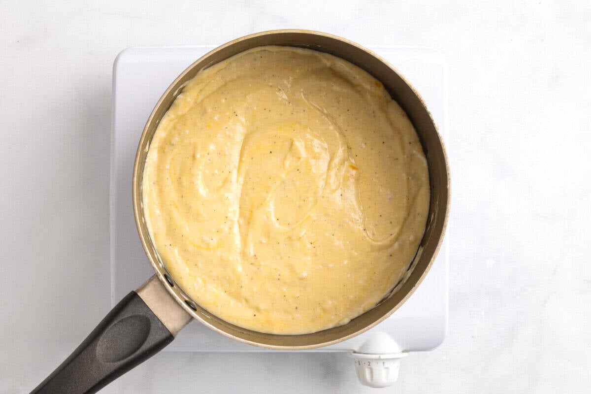 Cheese sauce in saucepan.