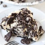 top shot of slice of oreo pie on white plate with fork