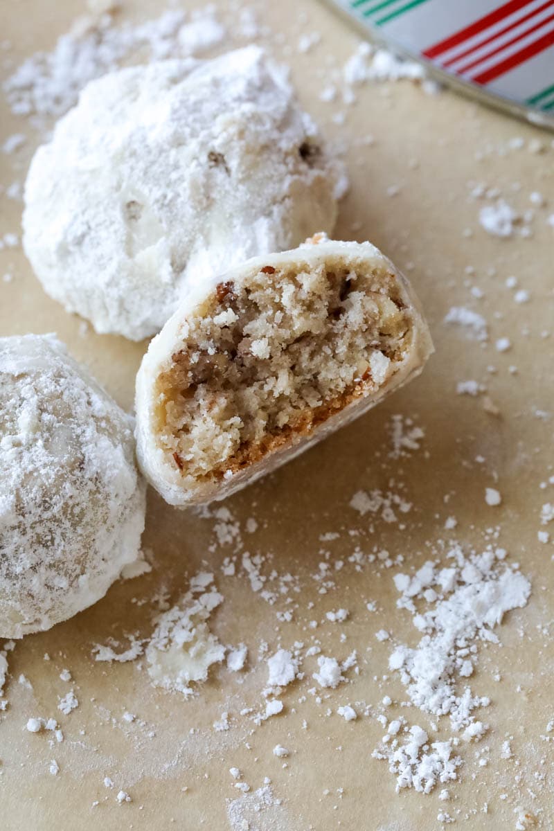 close up of snowball cookies with center showing 