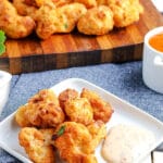 plate of popcorn chicken with dipping sauce