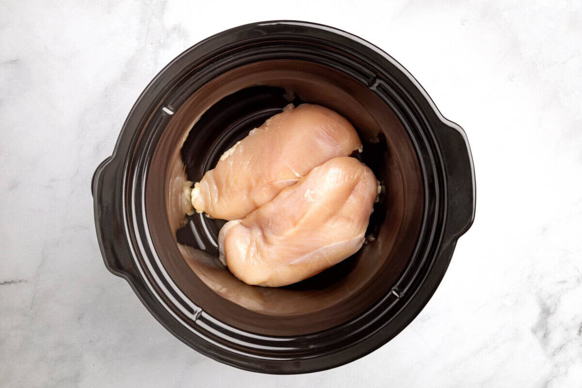 two chicken breasts in a crock pot