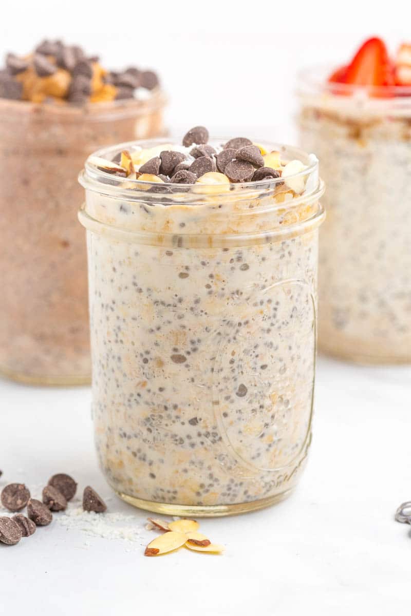 overnight oats with chia seeds in mason jar topped with chocolate chips.