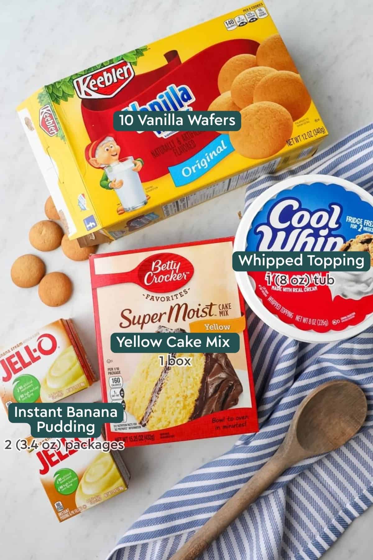 Ingredients for banana pudding poke cake, including wafers, cool whip, cake mix, pudding.