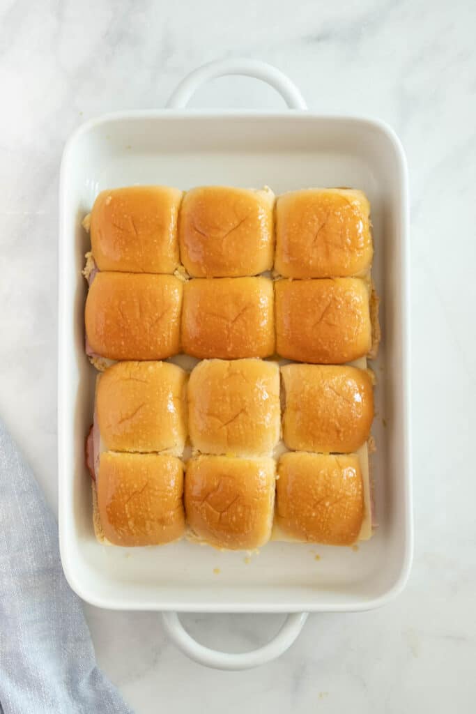 putting the sliders into the baking pan