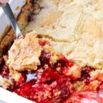 spoon digging into strawberry dump cake