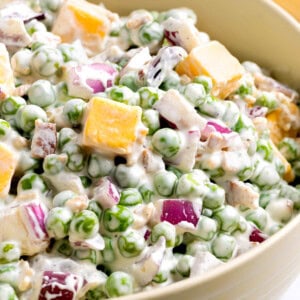 Pea salad in a bowl on a countertop ready for serving.