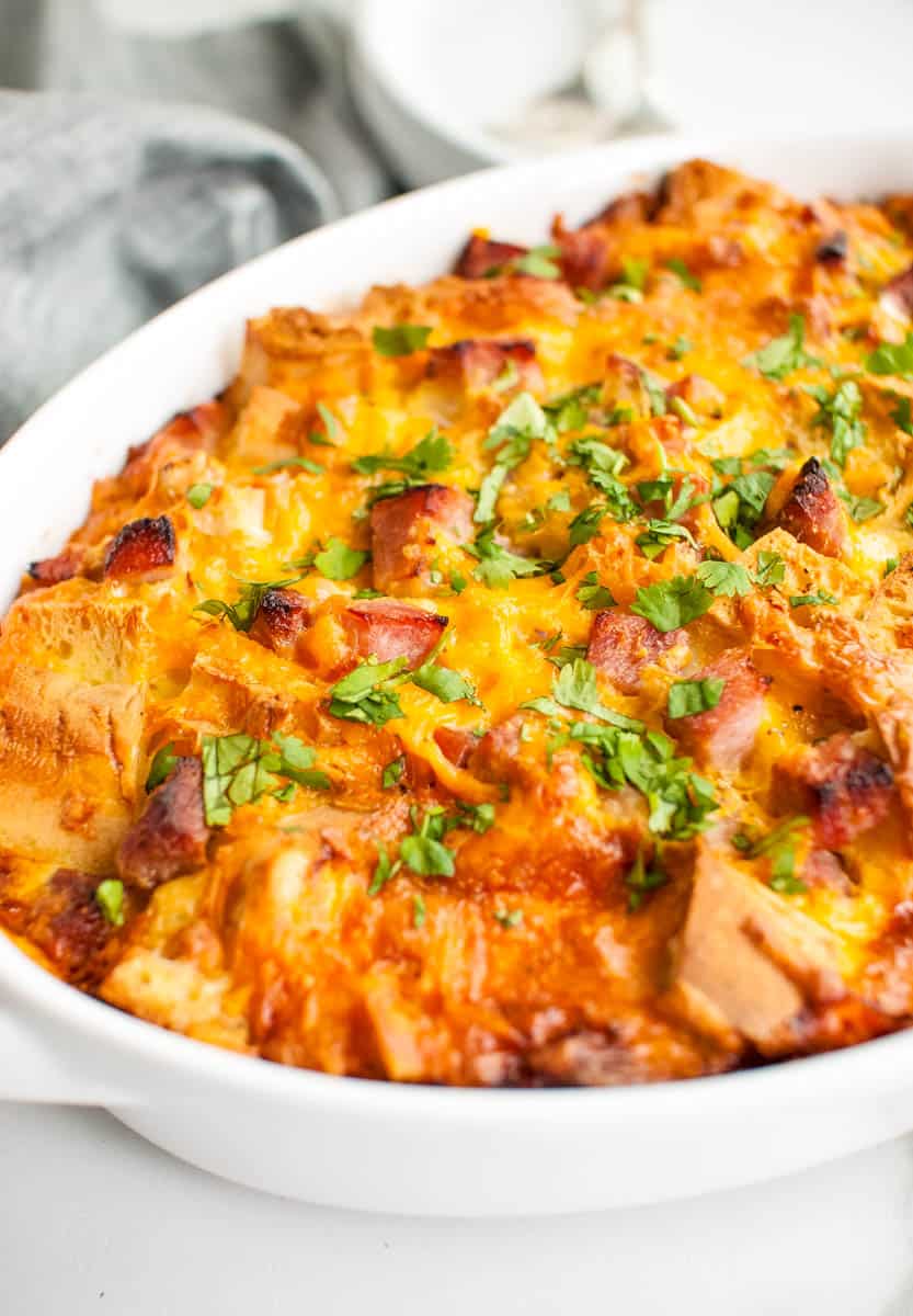 Ham and cheese breakfast casserole in a white dish