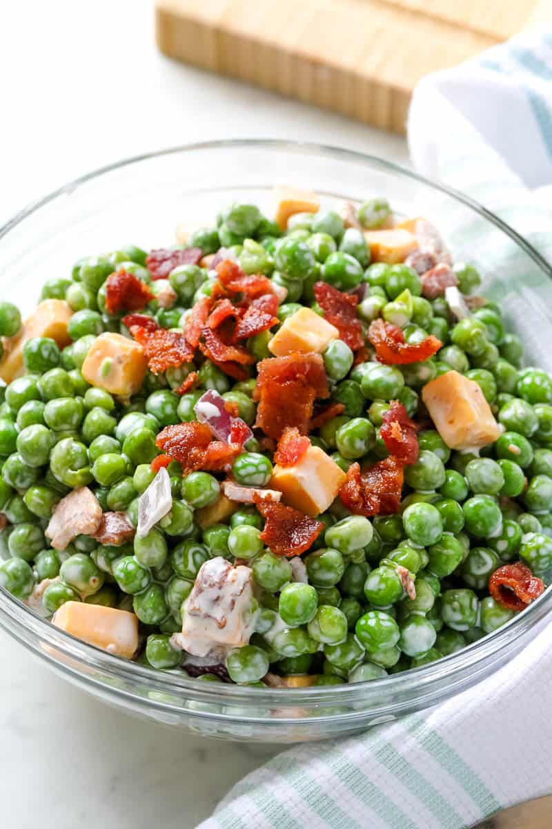 pea salad in a clear bowl.