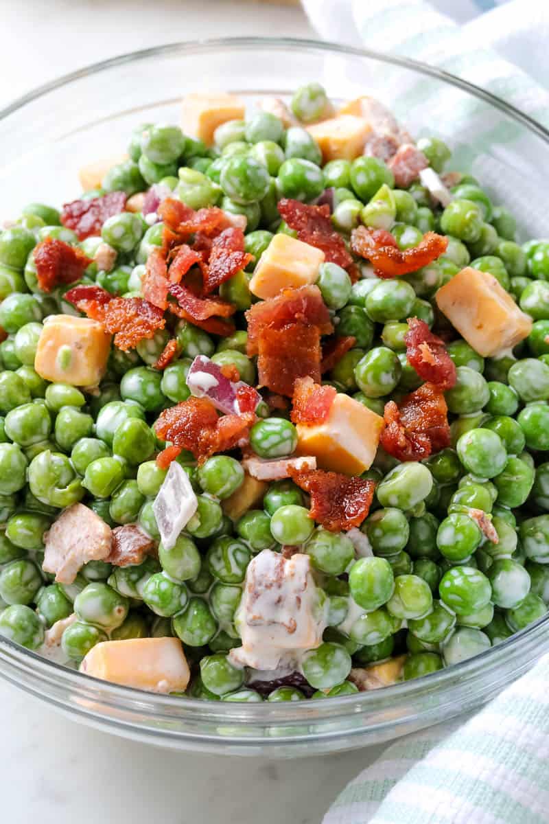 pea salad in a clear bowl.