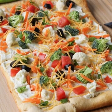 square veggie pizza on a cutting board