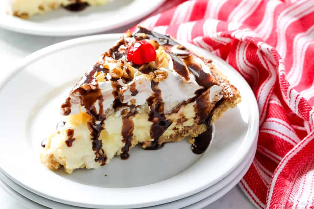 A slice of banana split pie on a plate.