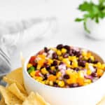 Black Bean and Corn Salsa in white bowl with chips