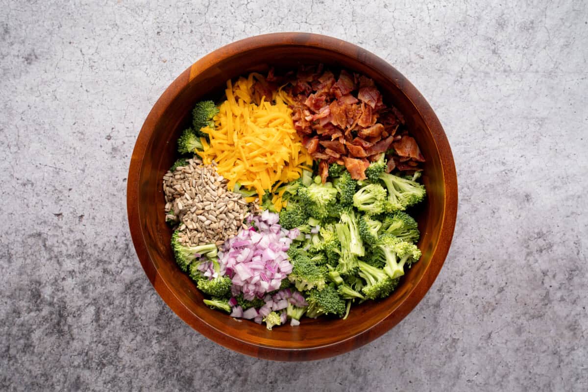 Ingredients for easy broccoli salad in bowl.