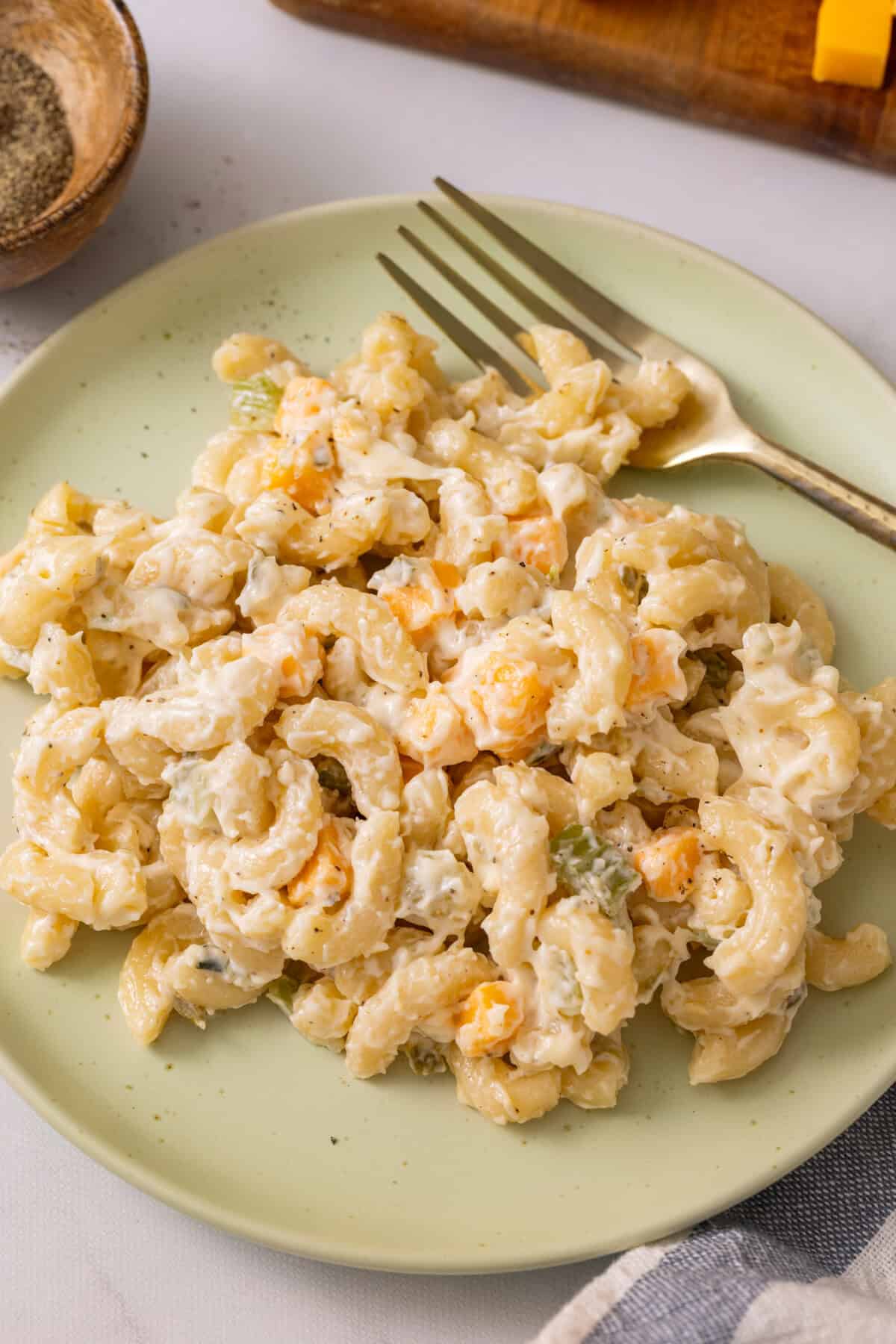 Plate of macaroni salad with fork.