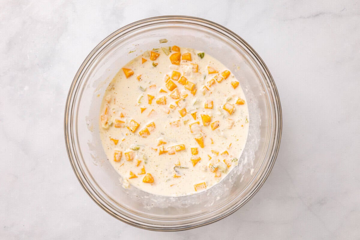 Dressing for macaroni pasta salad in bowl.