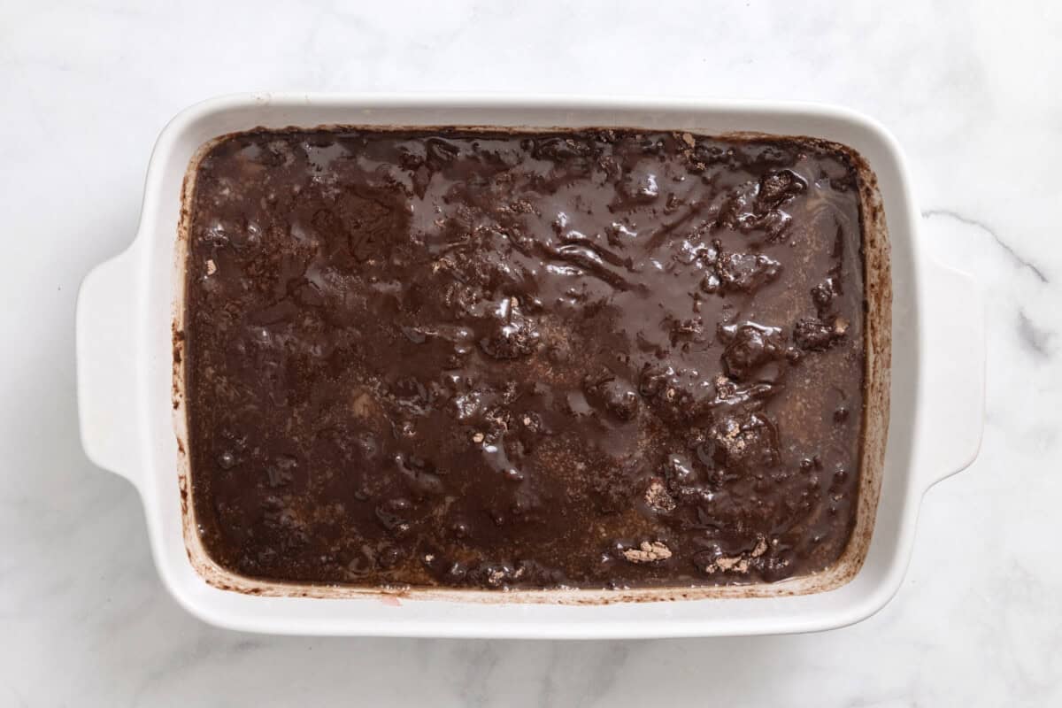 Unbaked chocolate cherry dump cake in pan.