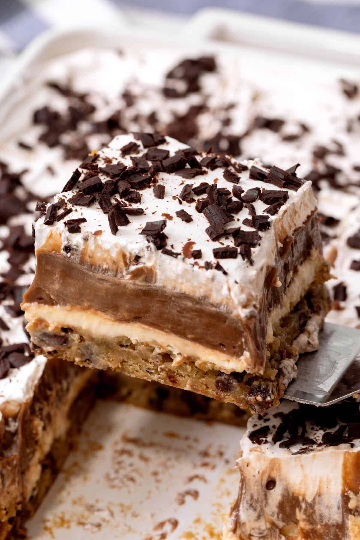 Slice of chocolate delight being lifted from pan.