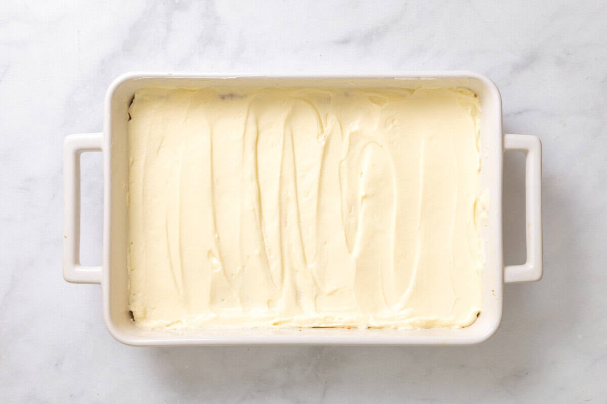 Cream cheese layer spread into pan.