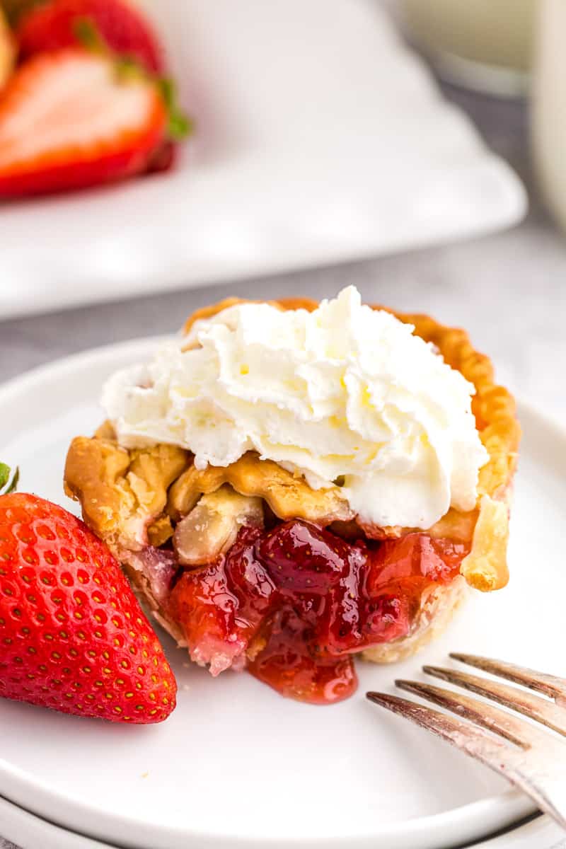 strawberry rhubarb pie on a white plate
