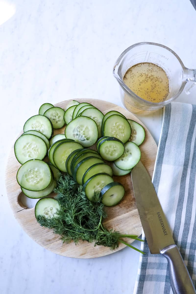 ingredients for cucumber salad - cucumbers, dill, vinegar