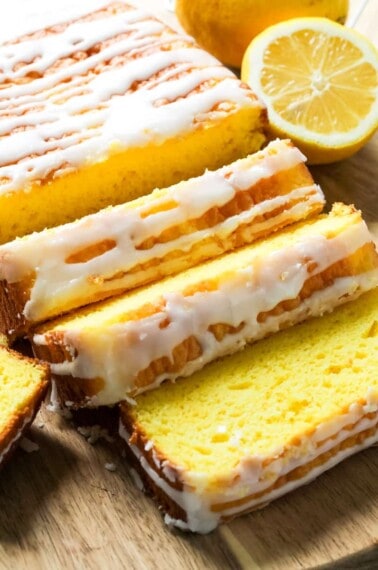sliced lemon loaf bread recipe with glaze drizzled on top
