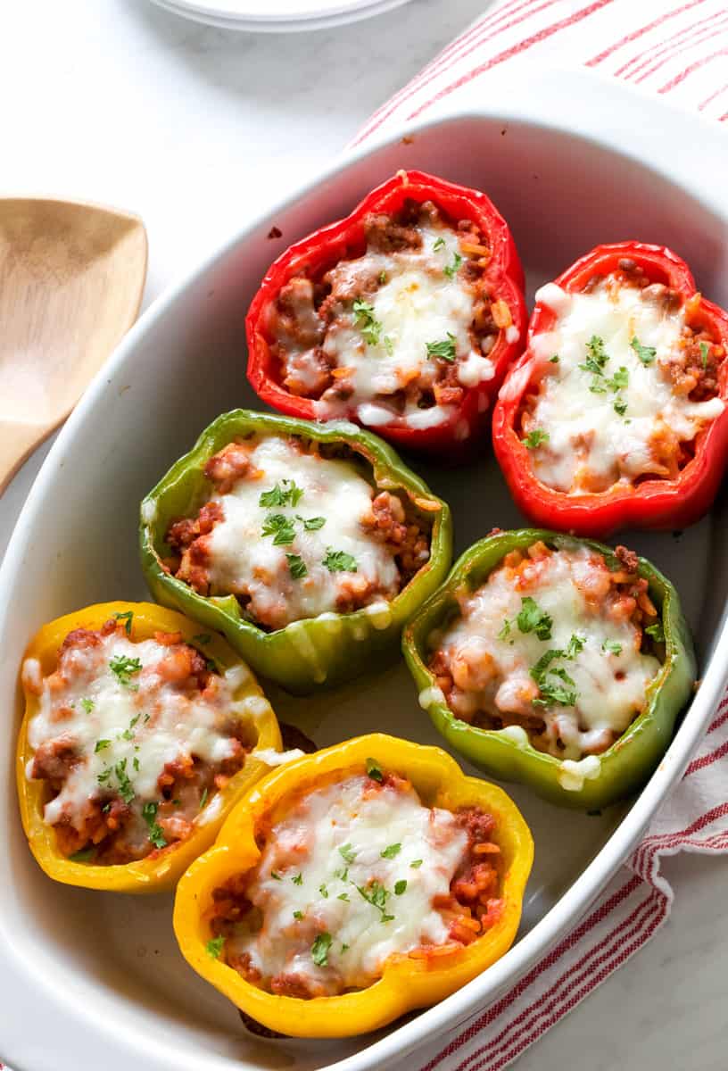 stuffed peppers in a white dish