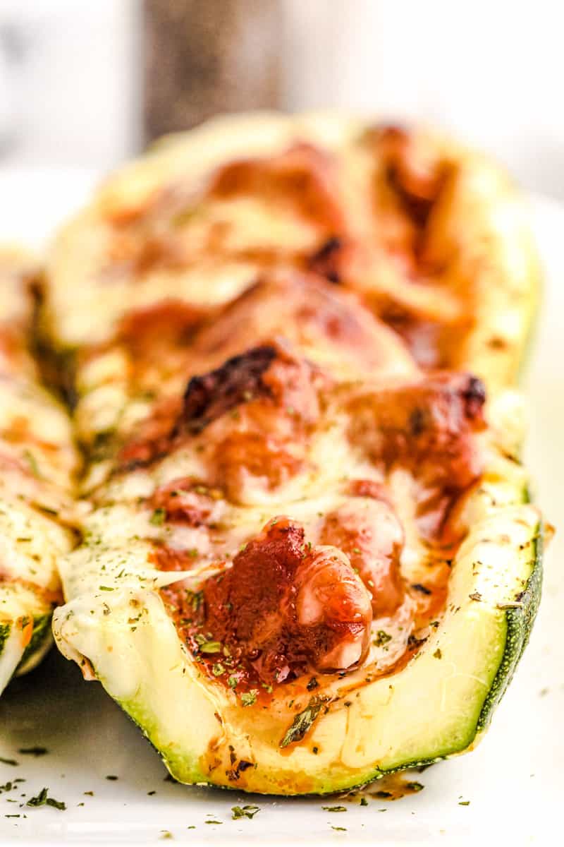 closeup shot of zucchini boat stuffed with meat and cheese