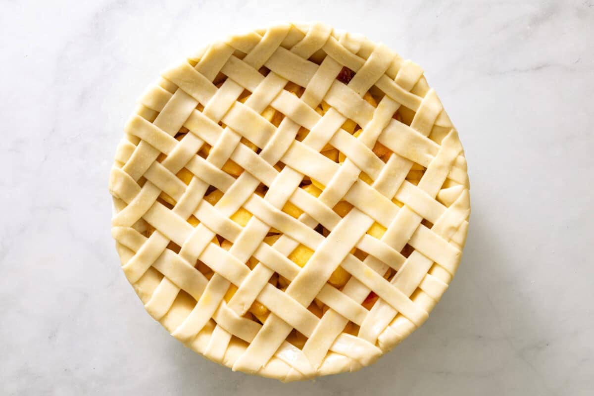 Lattice top peach pie before baking.