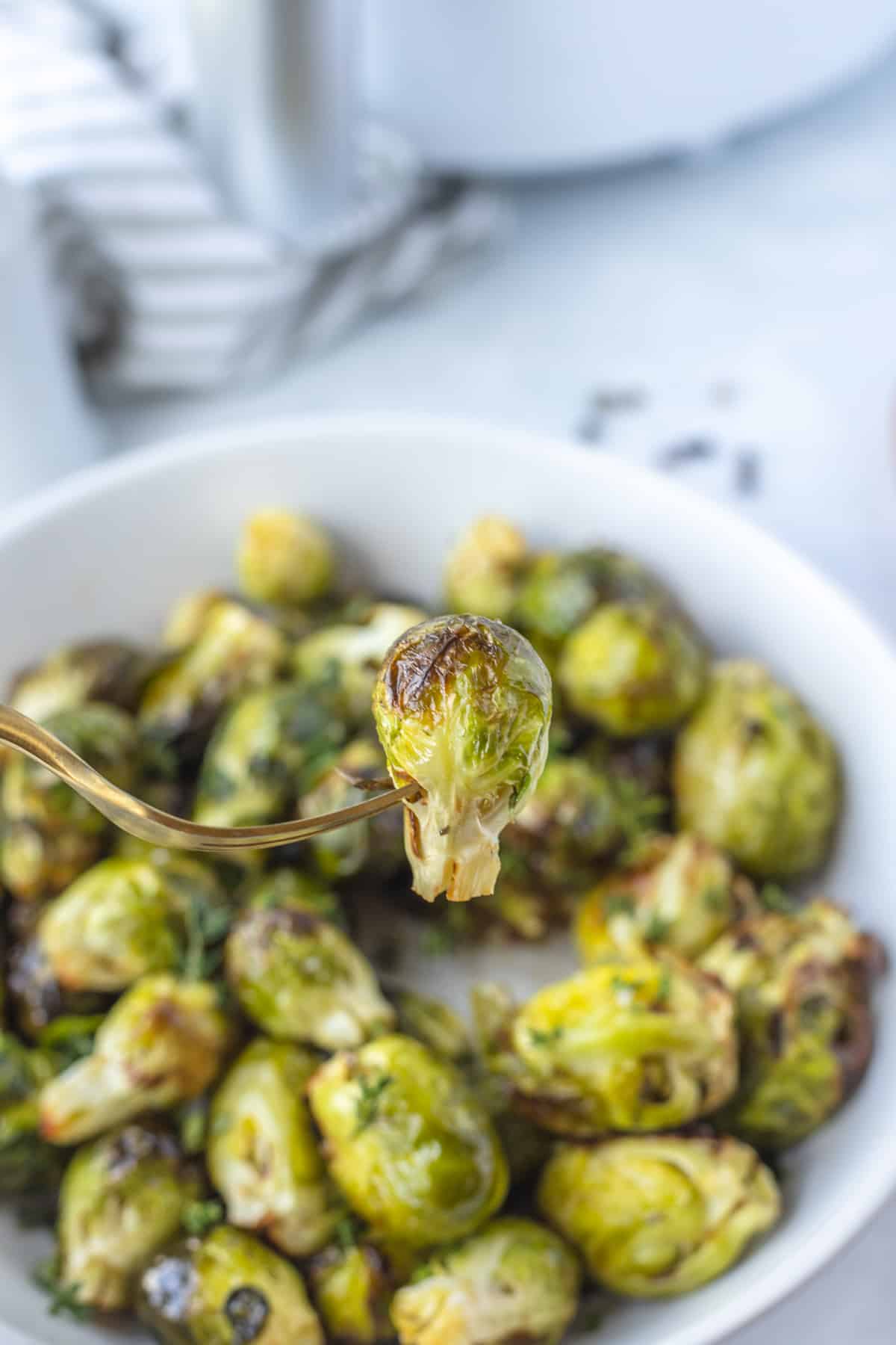 air fryer brussels sprout on a gold fork