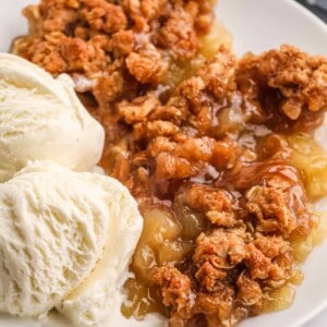 serving of apple crumble with ice cream.