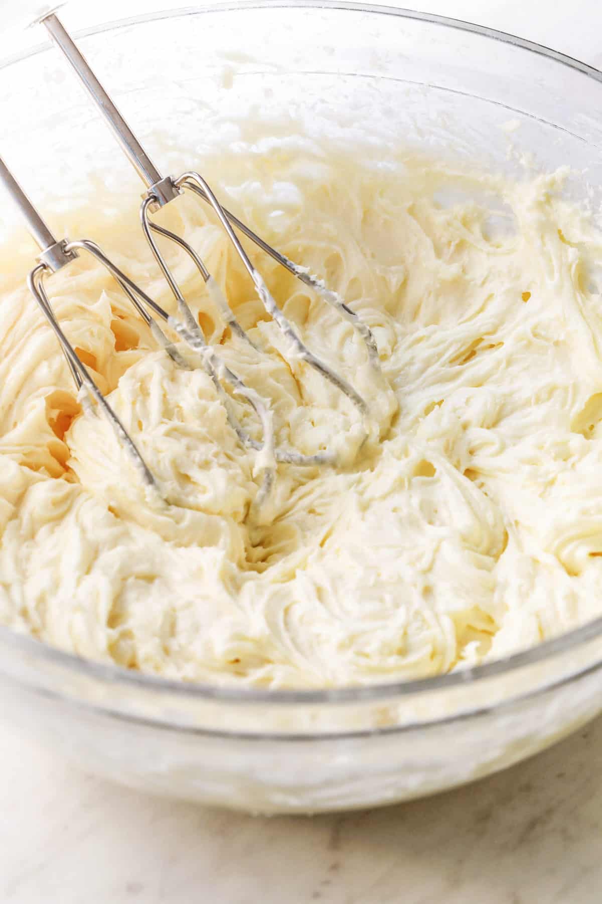 a bowl of cream cheese frosting 