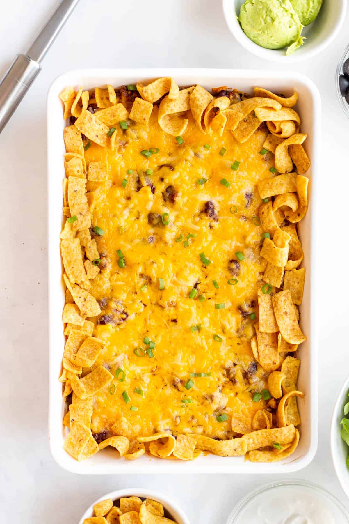 Baked frito pie casserole in dish.