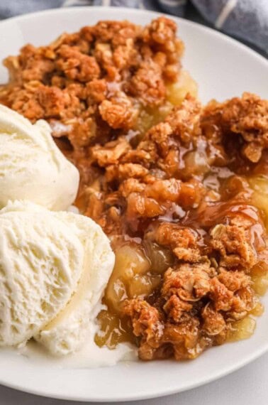 serving of apple crumble with ice cream.