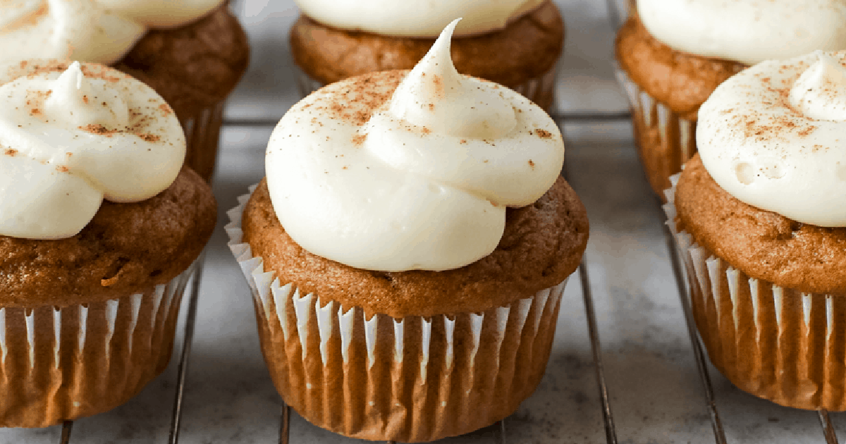 pumpkin cupcakes topped with cream cheese frosting