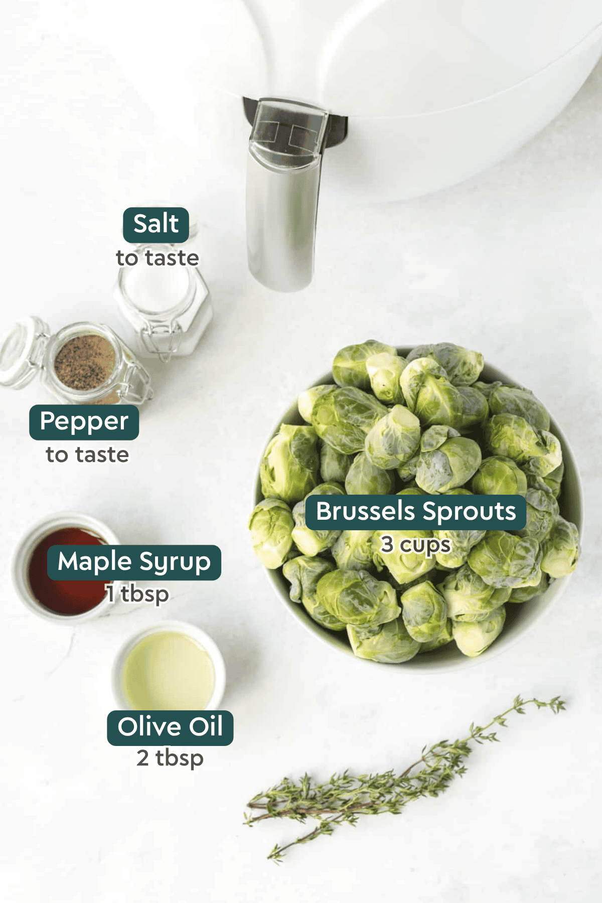 Ingredients for air fryer brussels sprouts, including salt, pepper, maple syrup, oil, and brussels sprouts.