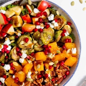 brussels sprouts salad served in a white bowl