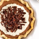 french silk pie with homemade pie crust whipped cream and chocolate shavings