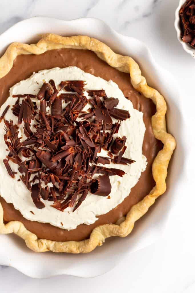 french silk pie with homemade pie crust whipped cream and chocolate shavings