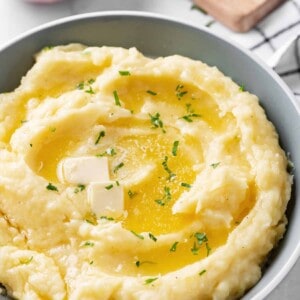 mashed potatoes with butter in a grey bowl