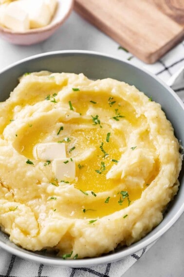 mashed potatoes with butter in a grey bowl