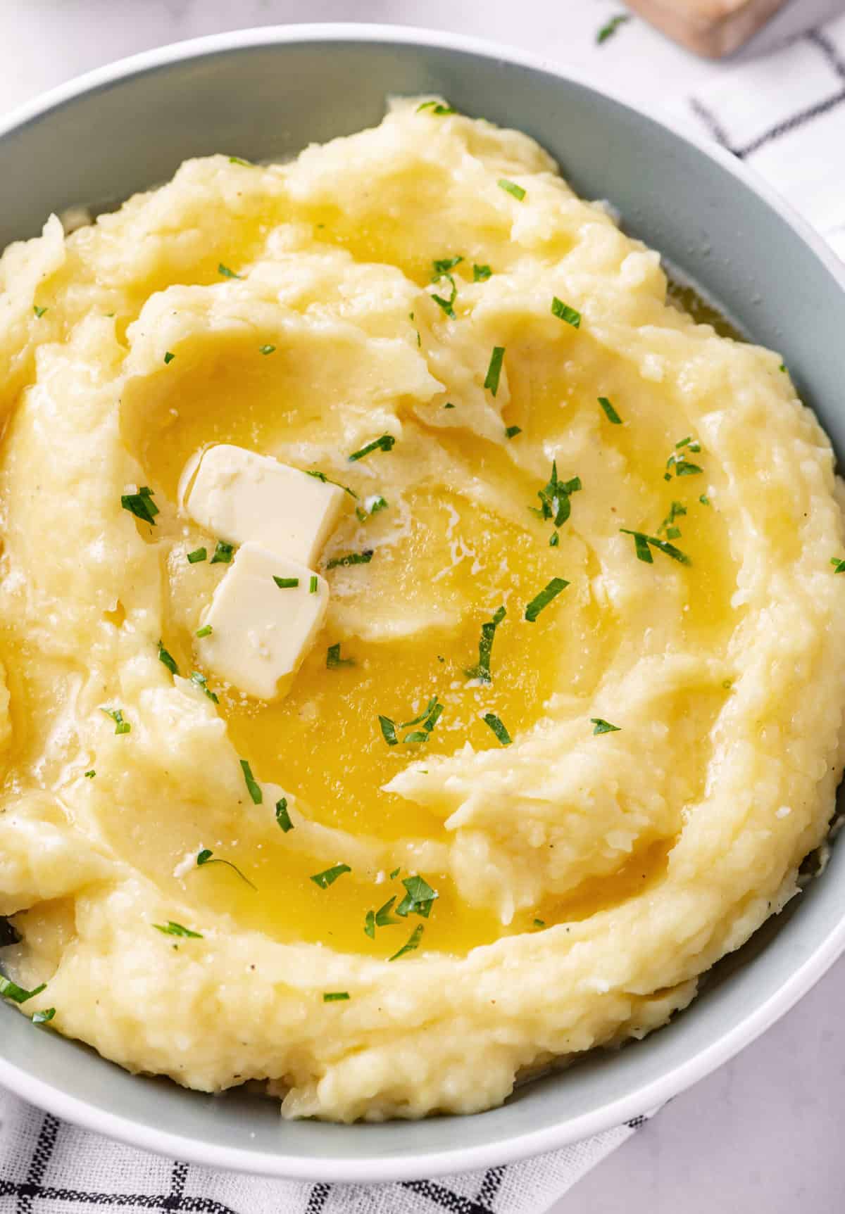 mashed potatoes with melted butter served in a bowl