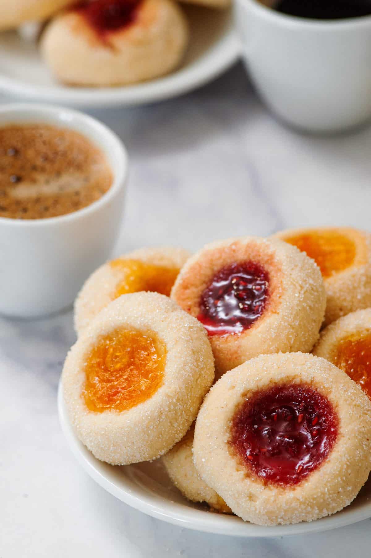 thumbprint cookies served in a white bowl.