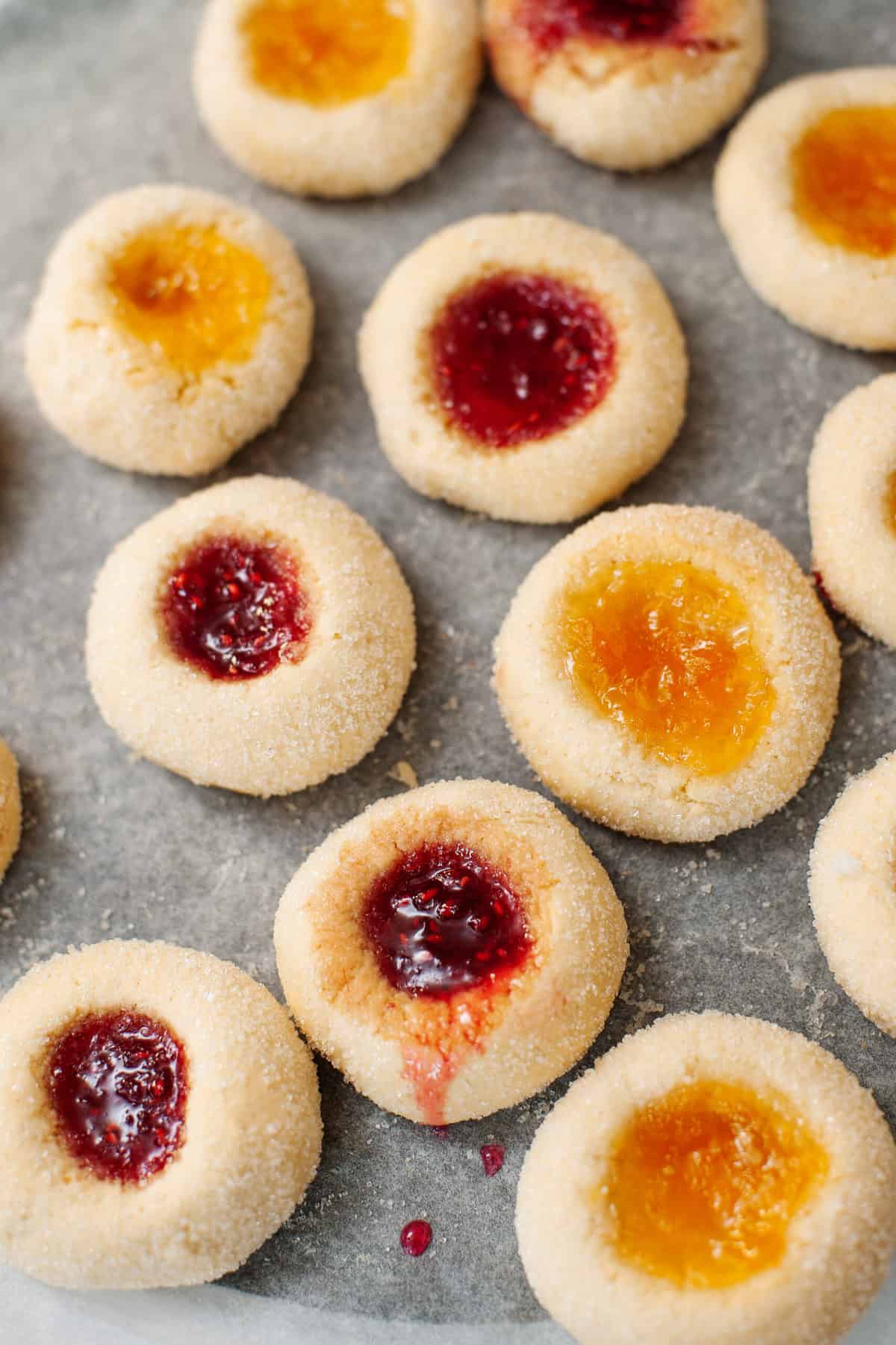 thumbprint cookies on parchment paper