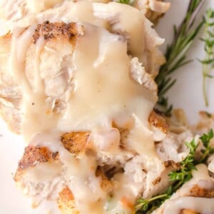 turkey gravy on turkey served on a plate
