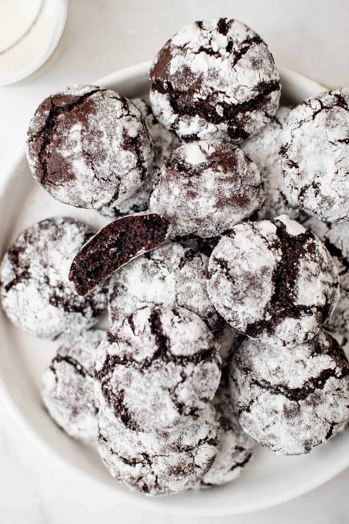 chocolate crinkle cookies served on a white round plate. 