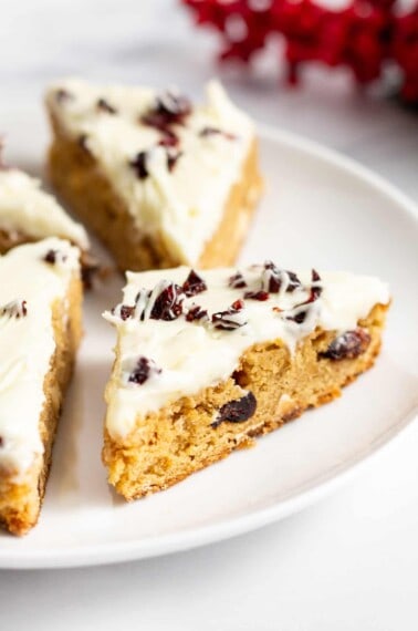 Homemade Cranberry Bliss Bars on a plate.