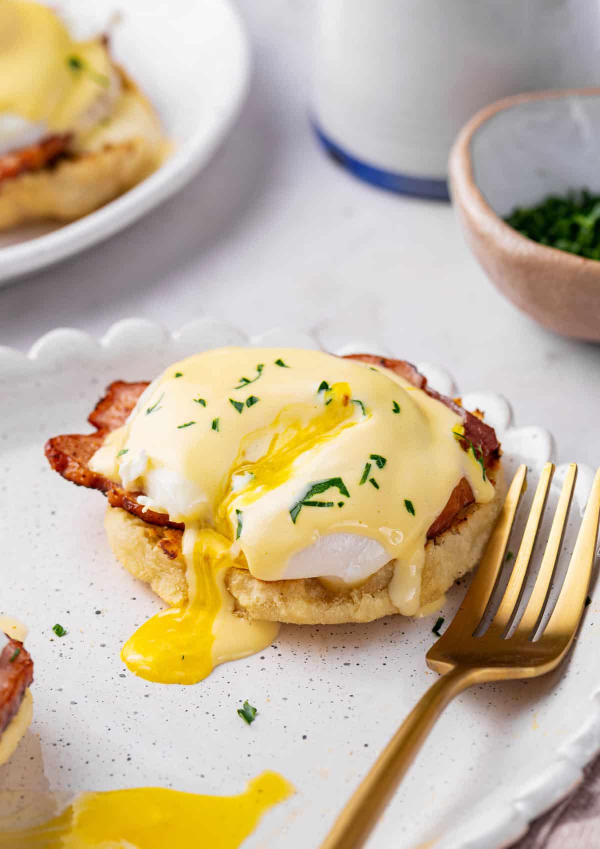poached egg on an eggs benedict with hollandaise sauce