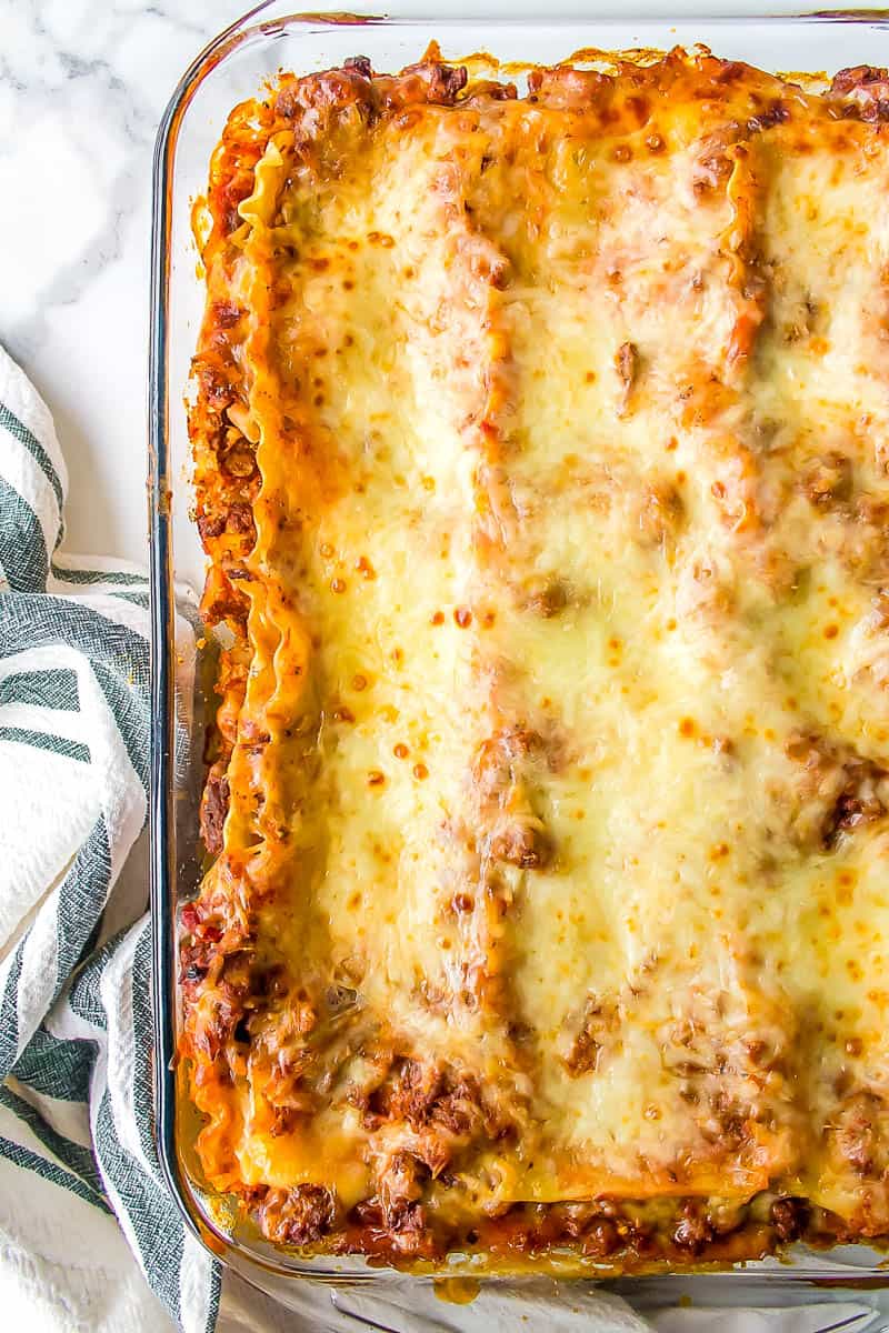 baked lasagna in a glass casserole dish