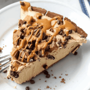 slice of no bake chocolate peanut butter pie served on a plate.