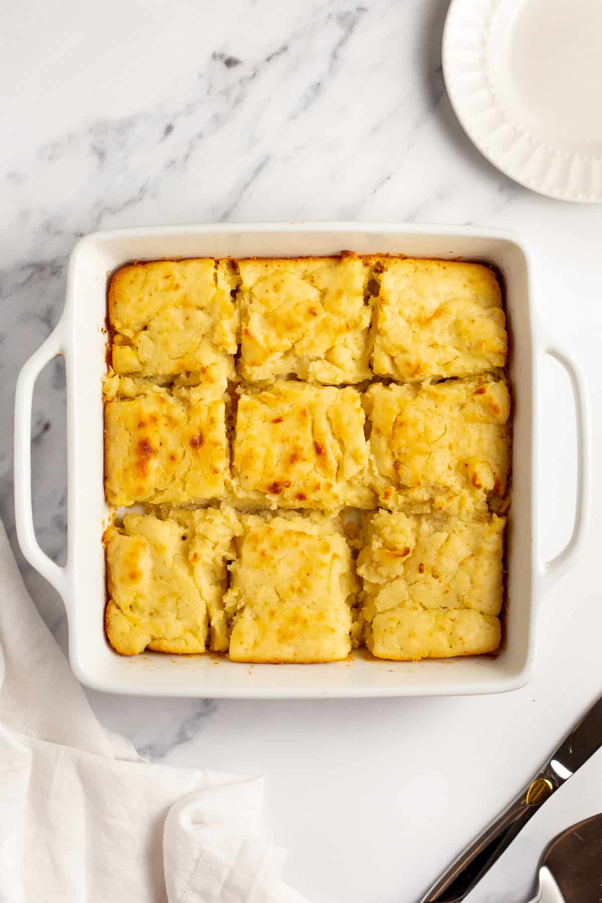 butterswim biscuits cut into nine squares served in a square baking dish